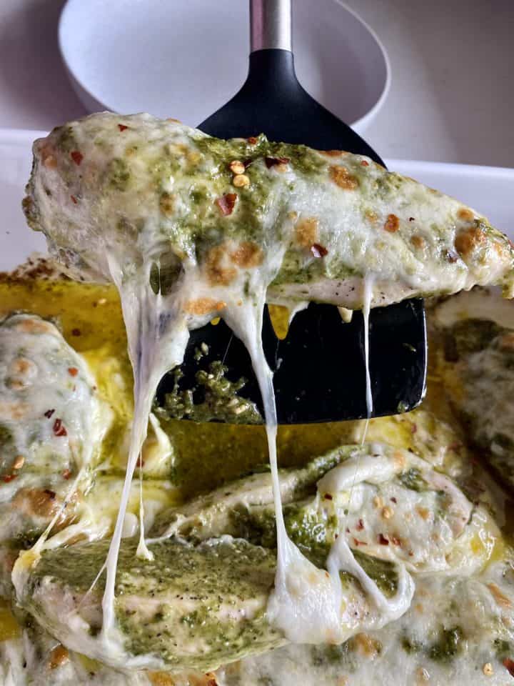 baked pesto chicken being served