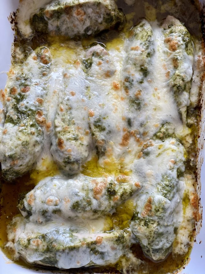 baked pesto chicken close up melted cheese