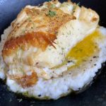 lemon butter chilean sea bass plated with dill