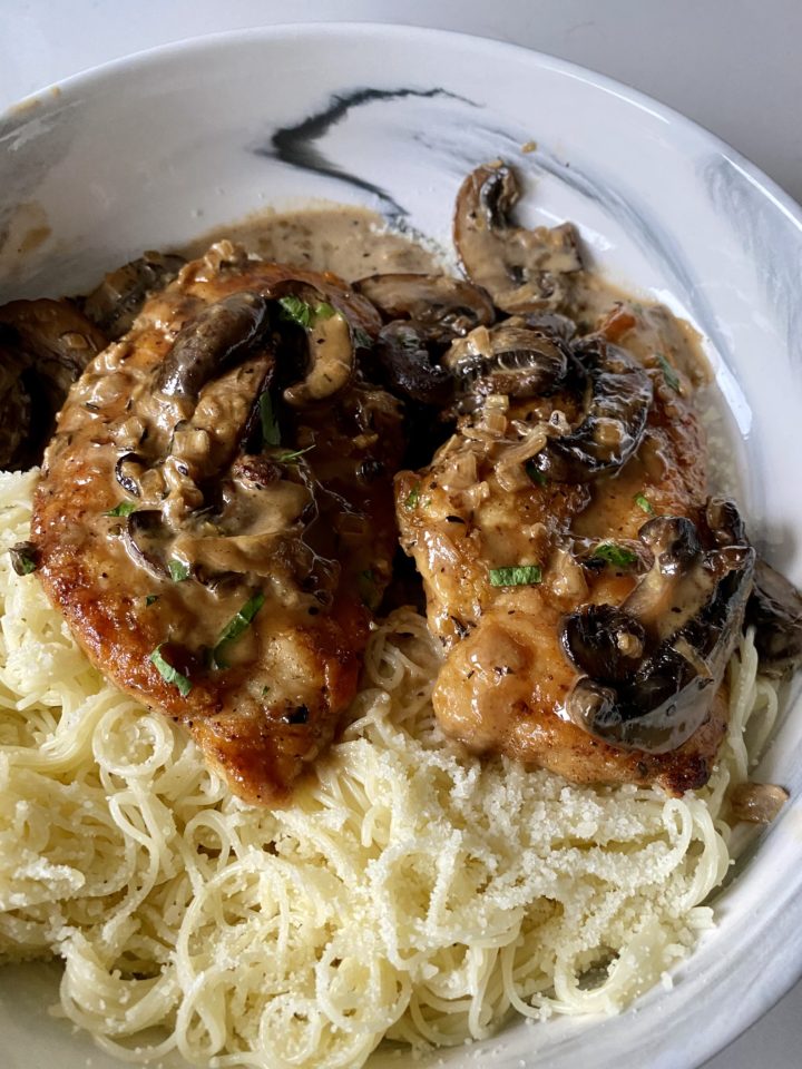 chicken marsala two pieces over pasta