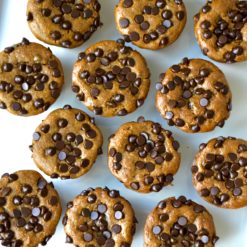 pumpkin chocolate muffins over tops