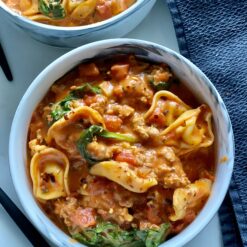 creamy tortellini soup in the bowls