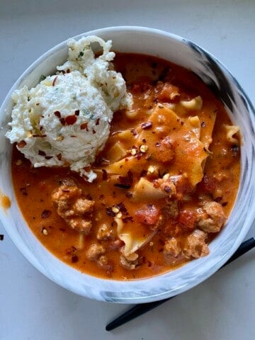 lasagna soup with ricotta scoop