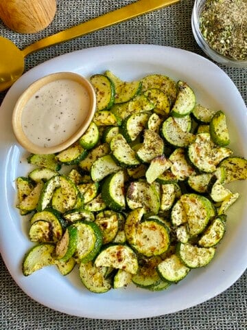ranch zucchini chips plated with dip