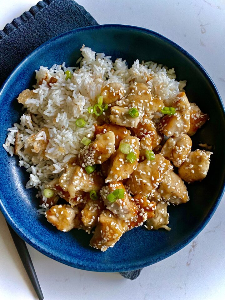 sesame chicken plated with rice