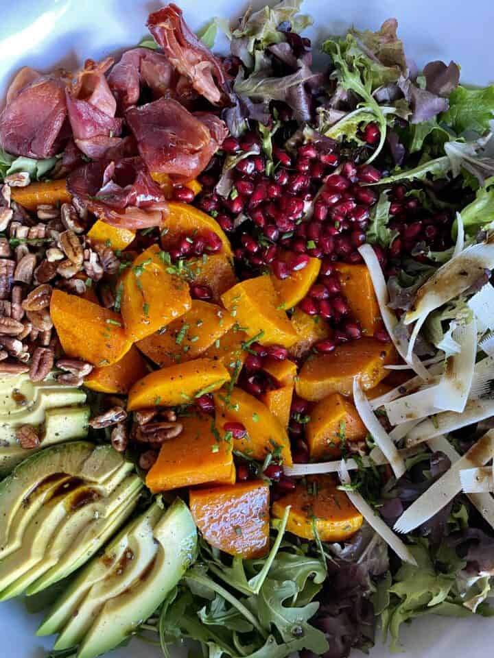 butternut squash salad with dressing close up