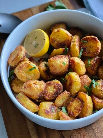 crispy lemon potatoes in a bowl