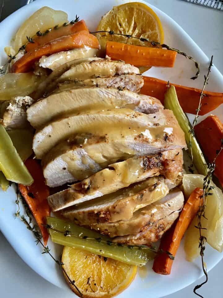 roasted turkey breast with gravy and vegetables