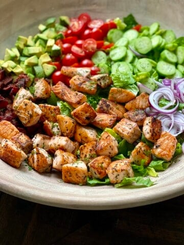 crispy salmon salad with creamy lemon feta dressing