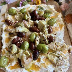 creamy feta board with olives and artichokes