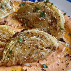 roasted cabbage wedges over tirokafteri