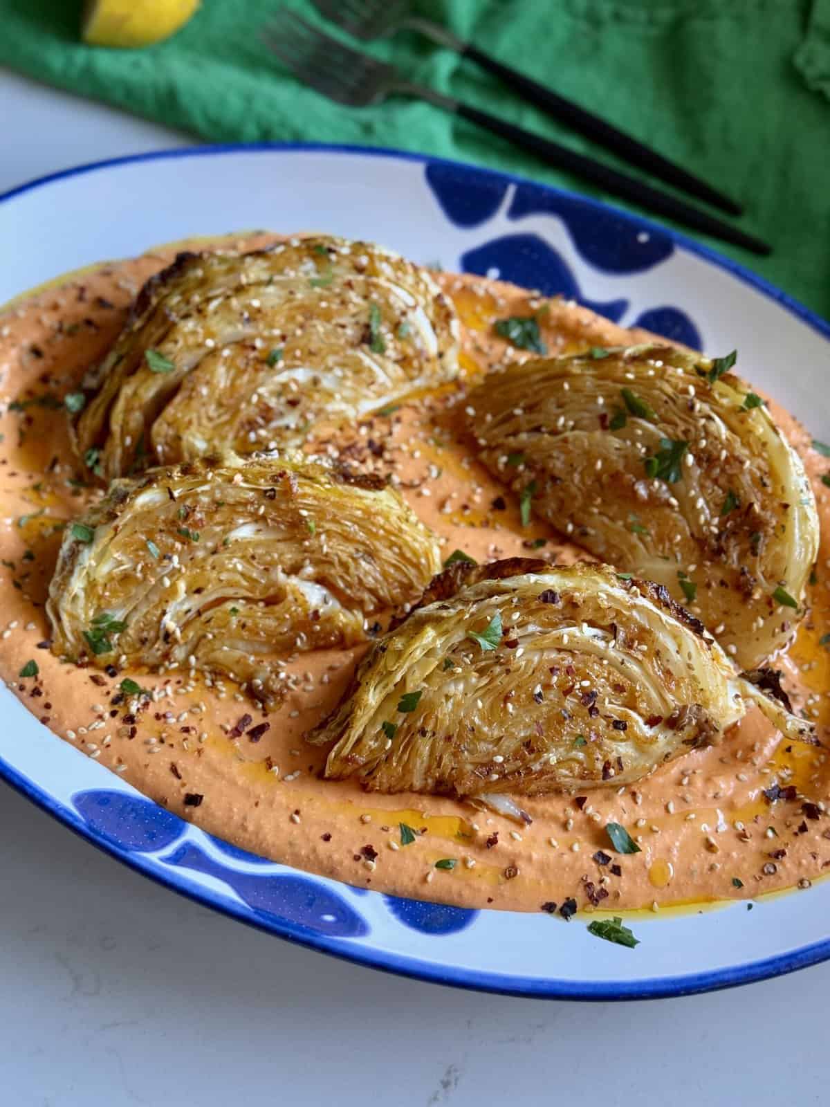 roasted cabbage wedges over tirokafteri