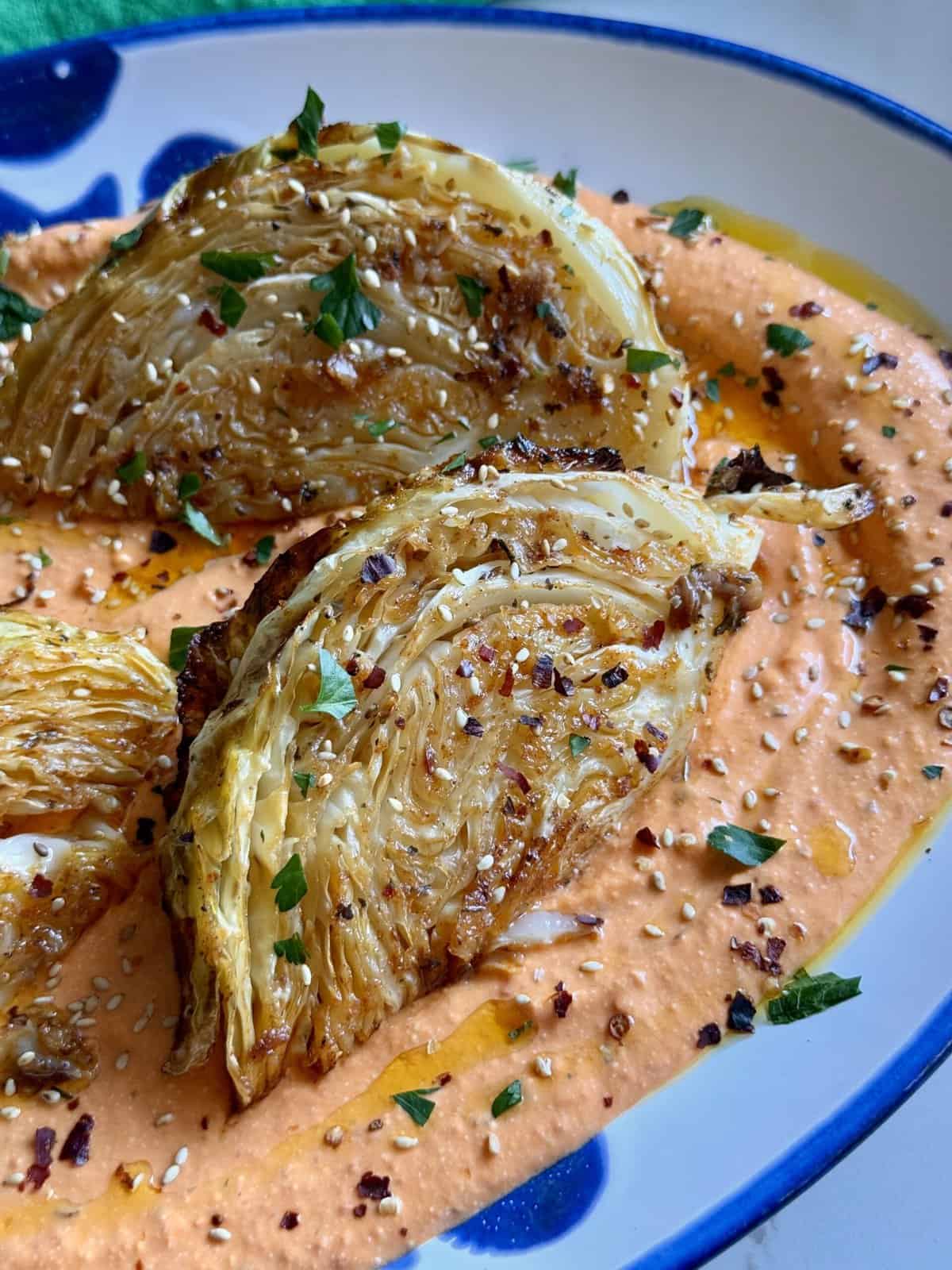 roasted cabbage wedges over tirokafteri